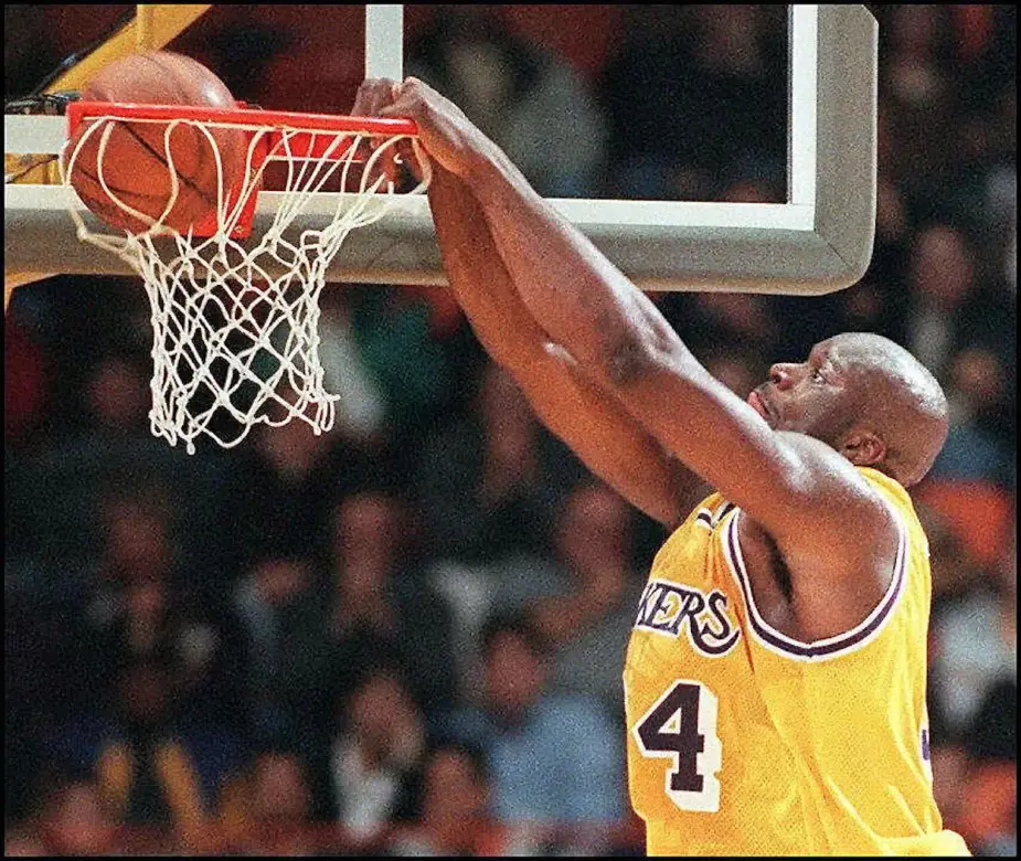 Shaquille O'Neal dunking a basketball in a Lakers game